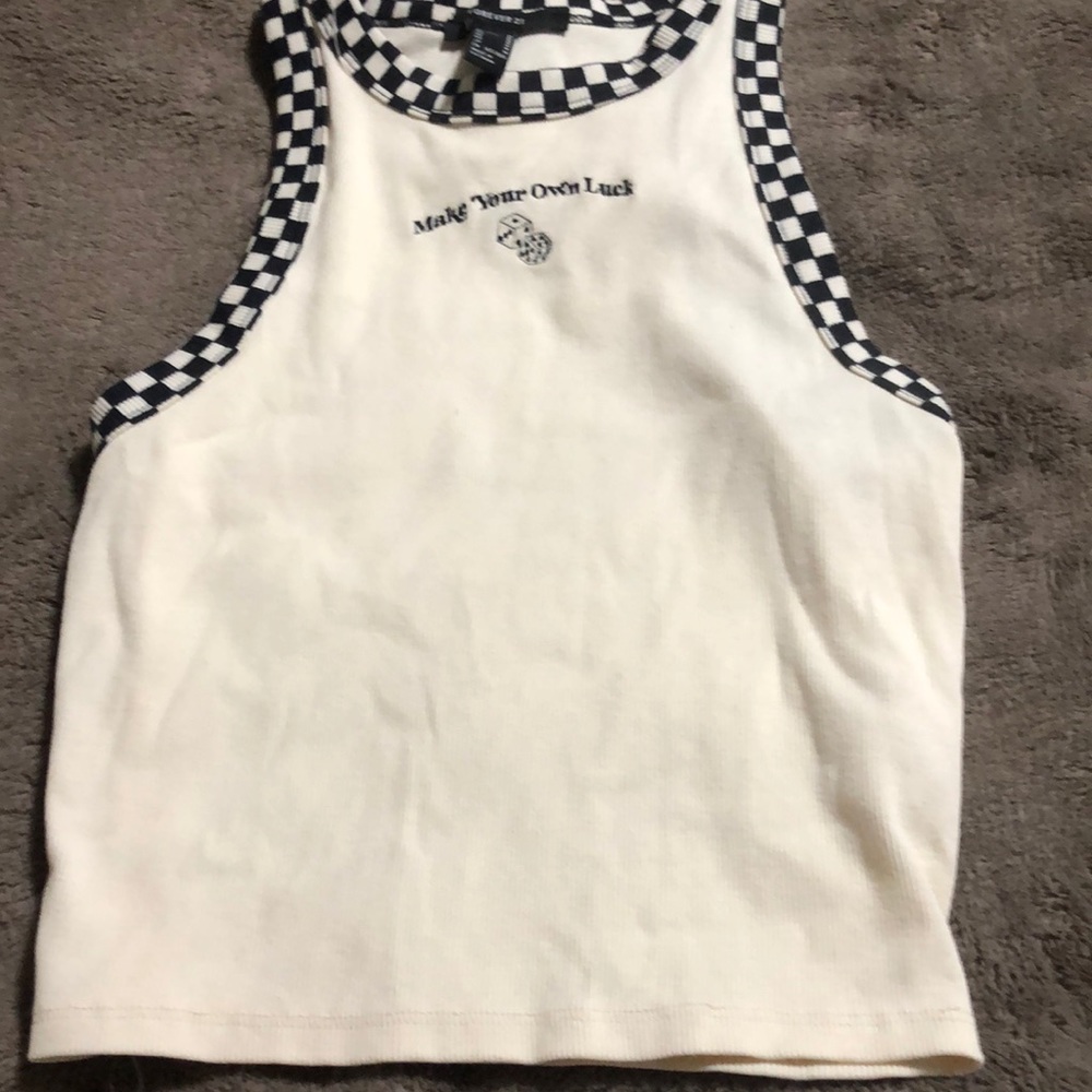 Cream colored crop top with checkered out line sowed in design